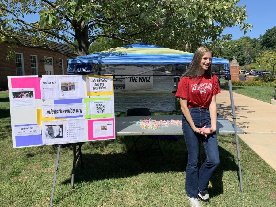 Editor in Chief, Rachel Phillips, manages The Voice 22 club fest booth. 