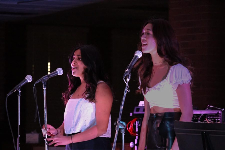 The spotlight shines on Jaida Smith '24 and Rebecca Sennaraj '24 as they sing a duet of "Somewhere Only We Know" by Keane