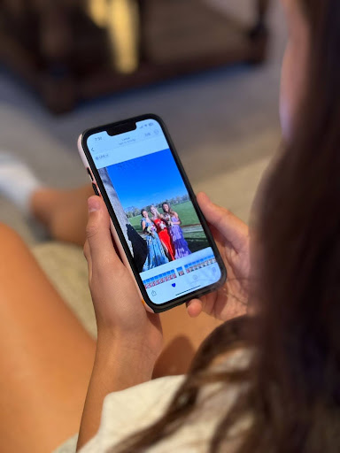 Scrolling through recent prom photos, Audrey Walker ‘28 favorites those she aims to use as inspiration. She ended up favoriting 23 photos of different dresses with a variety of colors and patterns. 