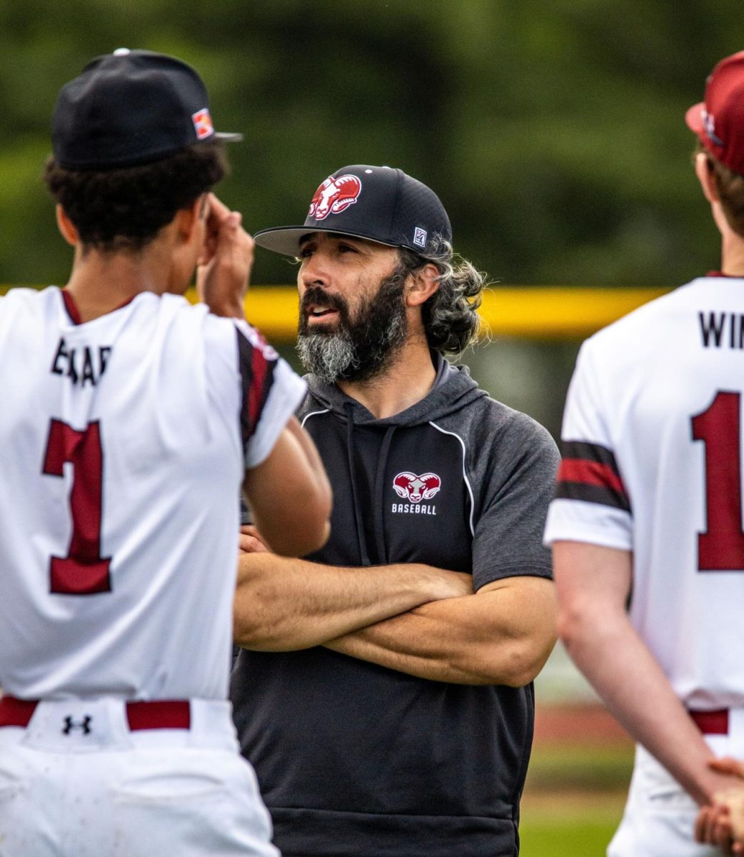 Debriefing a win, Coach Michael Kraatz talks to his team post-victory
versus rival John Burroughs.
