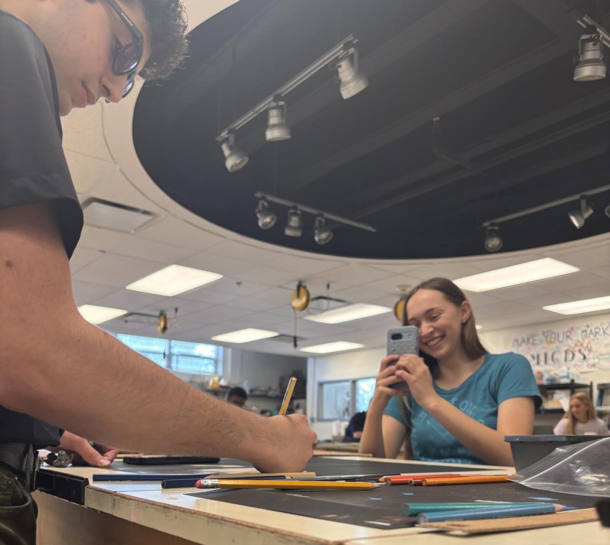 Sneaking a photo in, Catherine Dawson ‘26 captures art student Luca Becker ‘26 for her end-of-year ALT Journalism article.