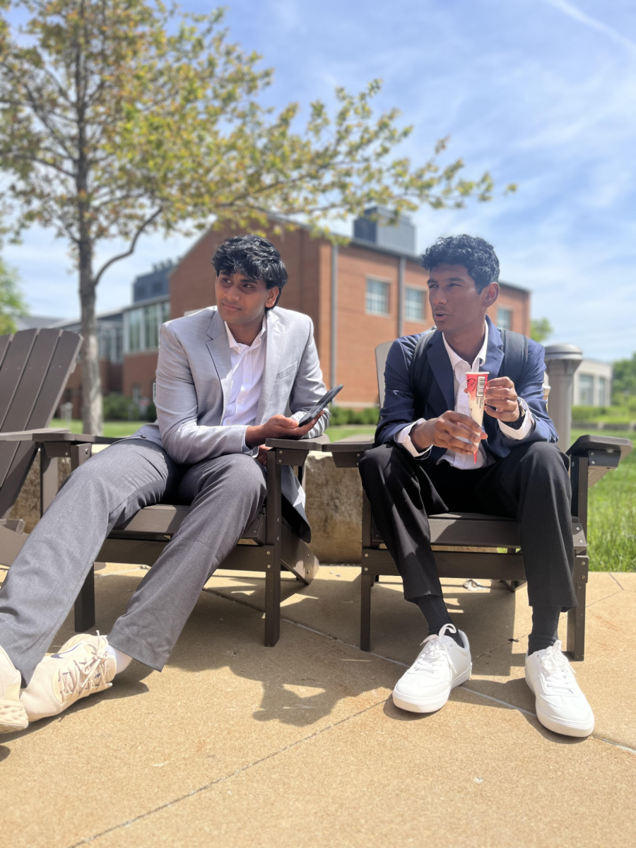 Discussing Speech and Debate, Karthik Krishnaswamy ‘26 interviews Neel Goriparthi ‘27 outside of Hearth on a professional dress day, April 21. The Upper School dress code was “Professional Dress” due to the Cum Laude induction.