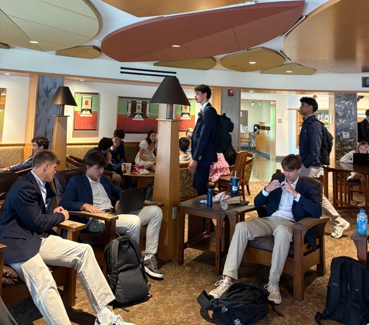 Dialing in, Ben Williams ‘26 and Henry Rohan ‘26 discuss an assignment while Graham Faust ‘26 examines his Senior Assassin goggles on April 21.